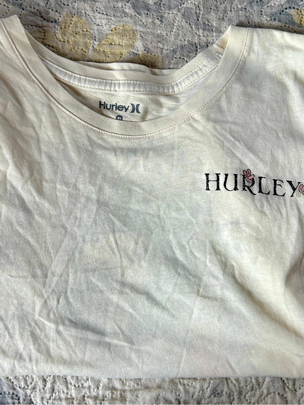 Hurley Cream Tee with Black Logo and Pink Floral Accents